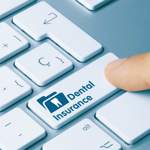 Patient checking dental insurance on computer