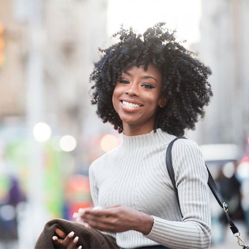 Woman smiling while enjoying a day on the town